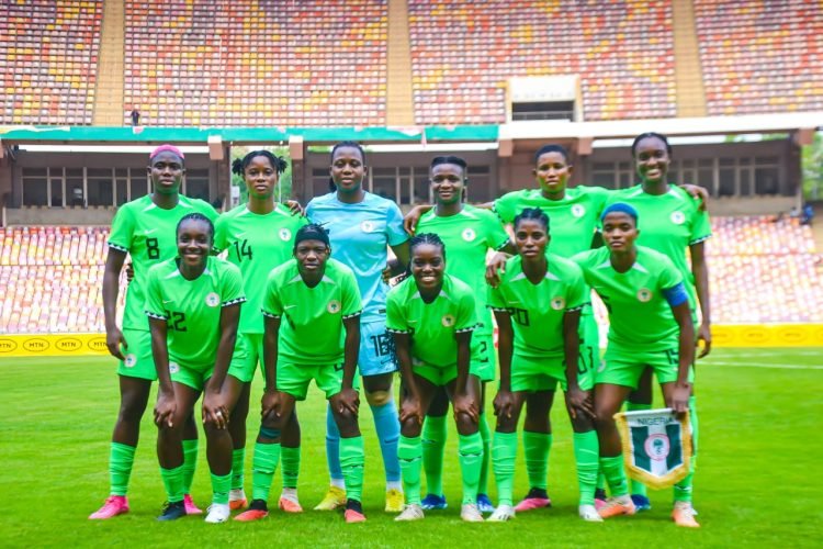The Super Falcons of Nigeria trashed Cape Verde 5-0 in a 2024 Women's Africa Cup of Nations WAFCON qualification first-leg match. THE ATHLETIC NG reports. Uchenna Kanu and Esther Okoronkwo both scored twice plus one goal by Gift Monday to seal a 5-0 trashing of Cape Verde by Nigeria in the first leg of the 2024 Women's Africa Cup of Nations qualifier. The match was played on Thursday, November 30, 2023 at the Moshood Abiola Stadium, Abuja. To reach the final qualifying round, Nigeria walked over São Tomé and Príncipe while Cape Verde flourished in a 6-3 aggregate win over Liberia. Nine-time African champions, the Super Falcons of Nigeria were near-perfect to take a convincing first-leg win In Abuja. US-based striker Uchenna Kanu scored the games opening goal in the seventh minute to set foundation for a big-win. Goalkeeper Chiamaka Nnadozie made a stunning save to deny Cape Verde an equalizer minutes later. The Coach Justin Madugu tutored Nigerian ladies were two-goals up when Tenerife forward, Gift Monday doubled the lead for the Falcons from a goal-mouth scramble in the 25th minute.. Nigeria dominated the encounter and got a deserved third when Uchenna Kanu finished off a pass from Sevilla midfielder, Toni Payne as the Falcons won 3-0 at the break. Esther Okoronkwo came on as a substitute in the 53rd minute, and got on the scoresheet soon after with a sublime finish from Akudo Ogbonna’s cross. Eleven minutes later, Esther Okoronkwo grabbed her second of the match as she pounced on Rofiat Imuran’s cross to make it 5-0 for Nigeria. It finished 5-0, Nigeria recording their biggest win in a competitive fixture since beating Equatorial Guinea 6-0 at the CAF Women’s Africa Cup of Nations in 2018. Cape Verde and Nigeria will meet again for the second leg on December 5, 2023 at the Estádio Nacional de Cabo Verde in Praia. The aggregate winner of this match will qualify for the 2023 Women's Africa Cup of Nations in Morocco.