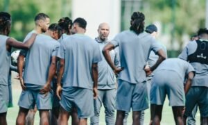 Coach Chelle tightens Super Eagles camp access after a dominant 2-0 win over Rwanda, ensuring full focus for the crucial Zimbabwe clash.